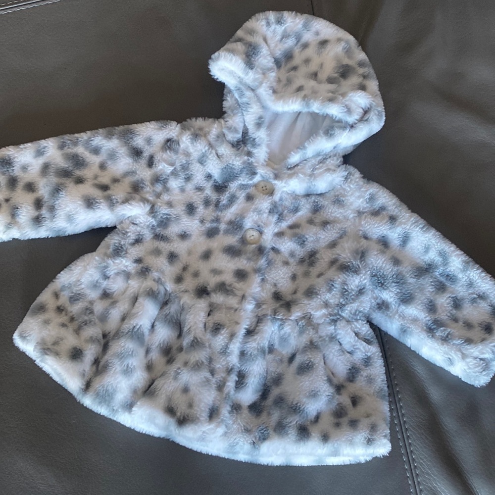Faux fur jacket with a hood for a baby girl
